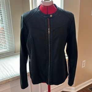 Faux leather, with polyester ribbed under sleeves and sides. Zippered pockets